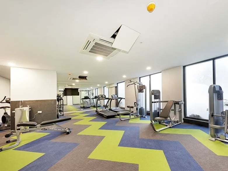Treadmills weight machines benches gym exterior at Belong Mascot in Sydney Student Accommodation