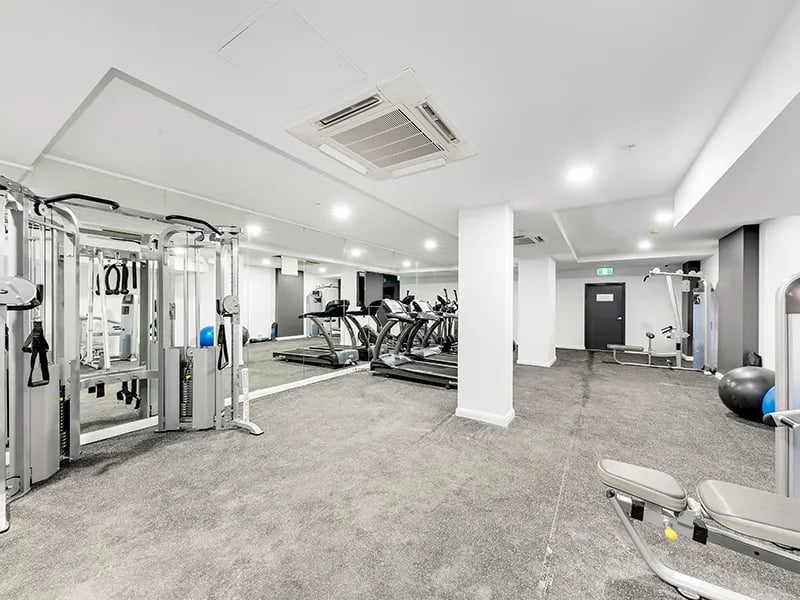 Gym with treadmills weight machines and benches gym at Belong Rosebery in Sydney Student Accommodation