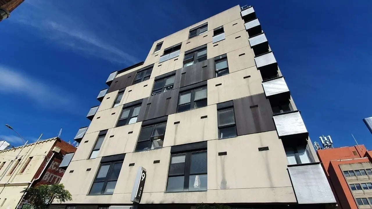 Modern building exterior with many windows and balconies exterior at Student Living On Campus in Melbourne Student Accommodation