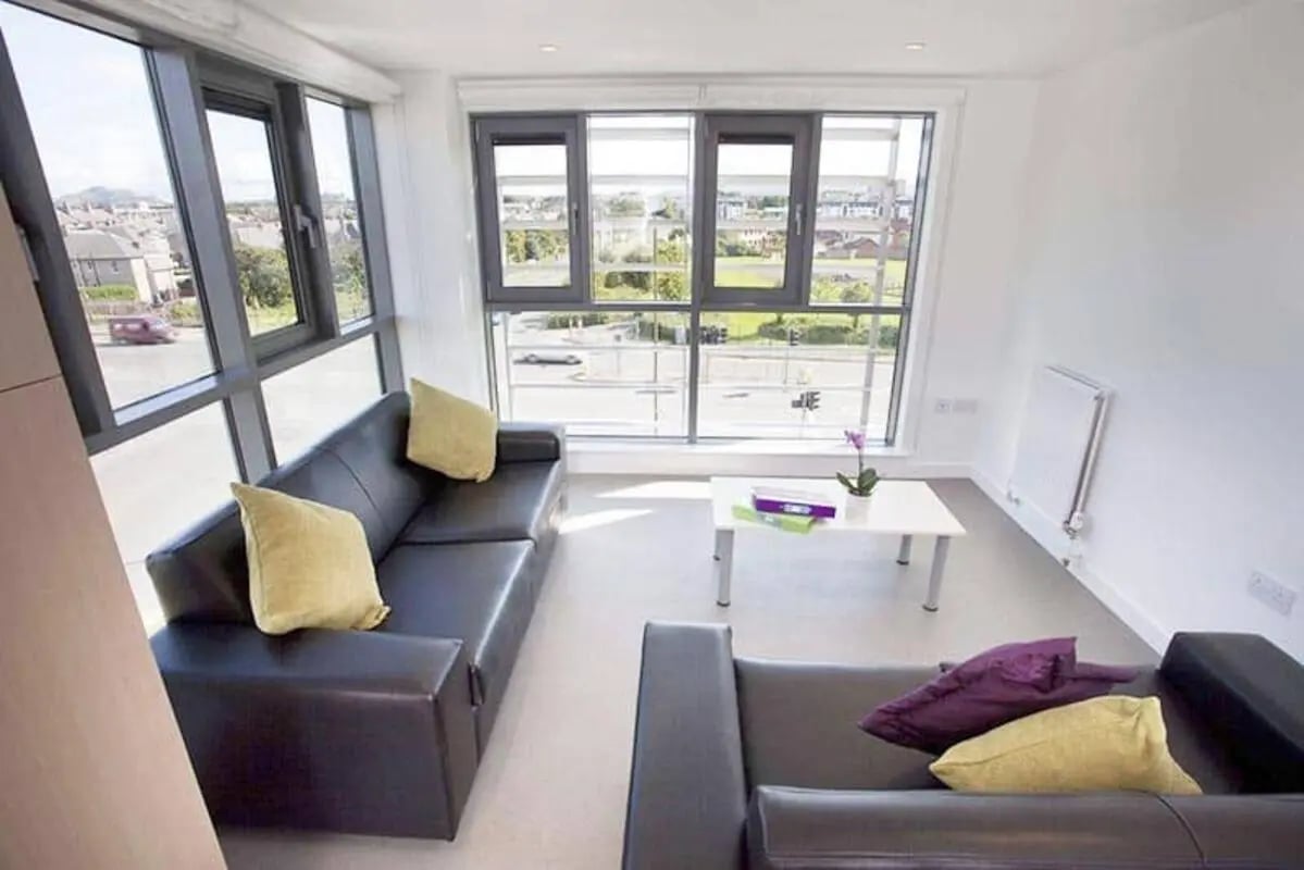 Sofa coffee table and plant Living room at Edinburgh College Residences in Edinburgh Student Accommodation