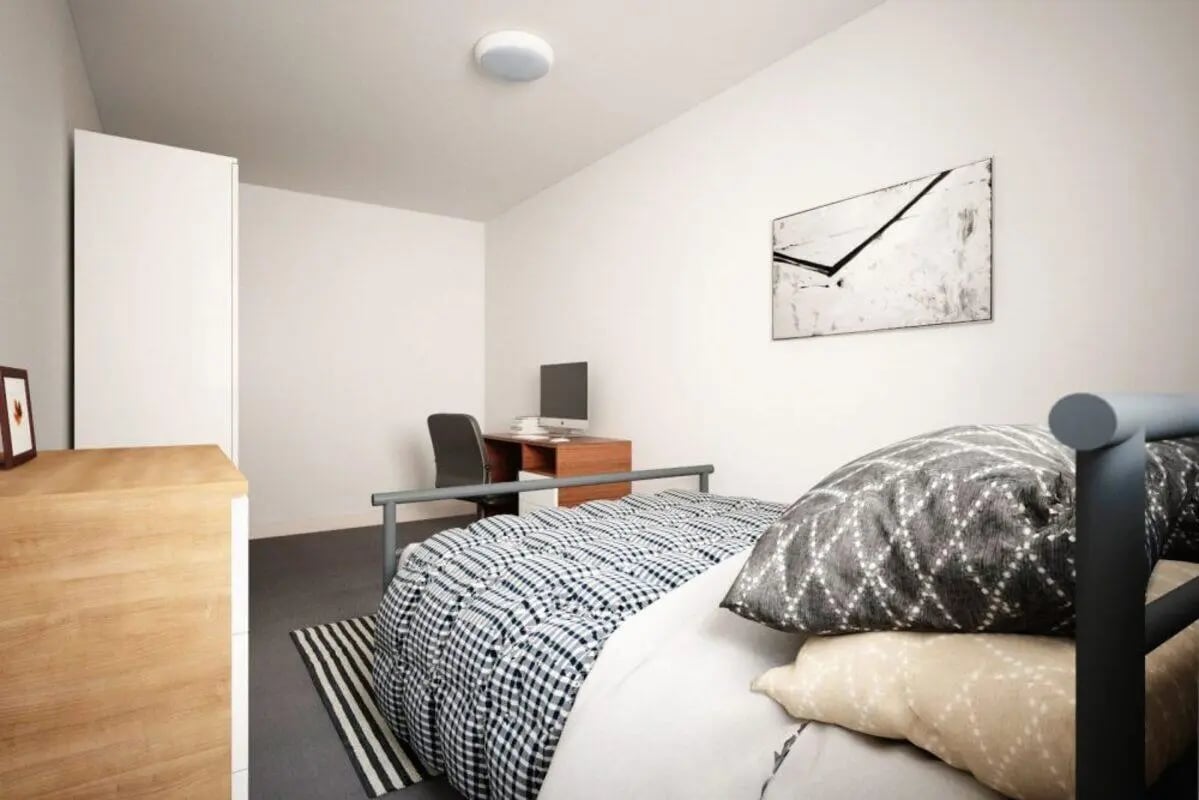 Bed desk chair wardrobe wooden dresser bedroom at Moss Court in Manchester Student Accommodation