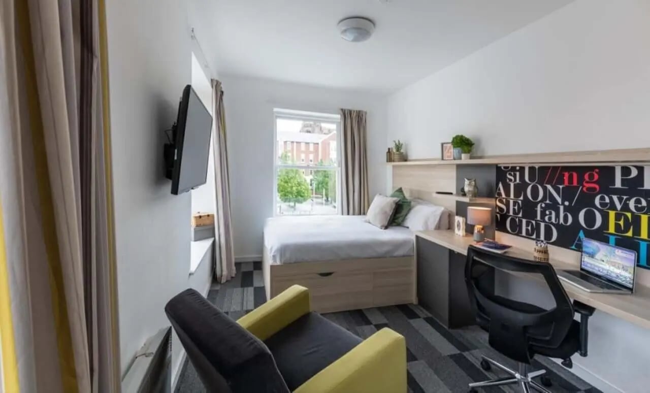 Bed desk chair television and window bedroom at The Arch - Liverpool in Liverpool Student Accommodation