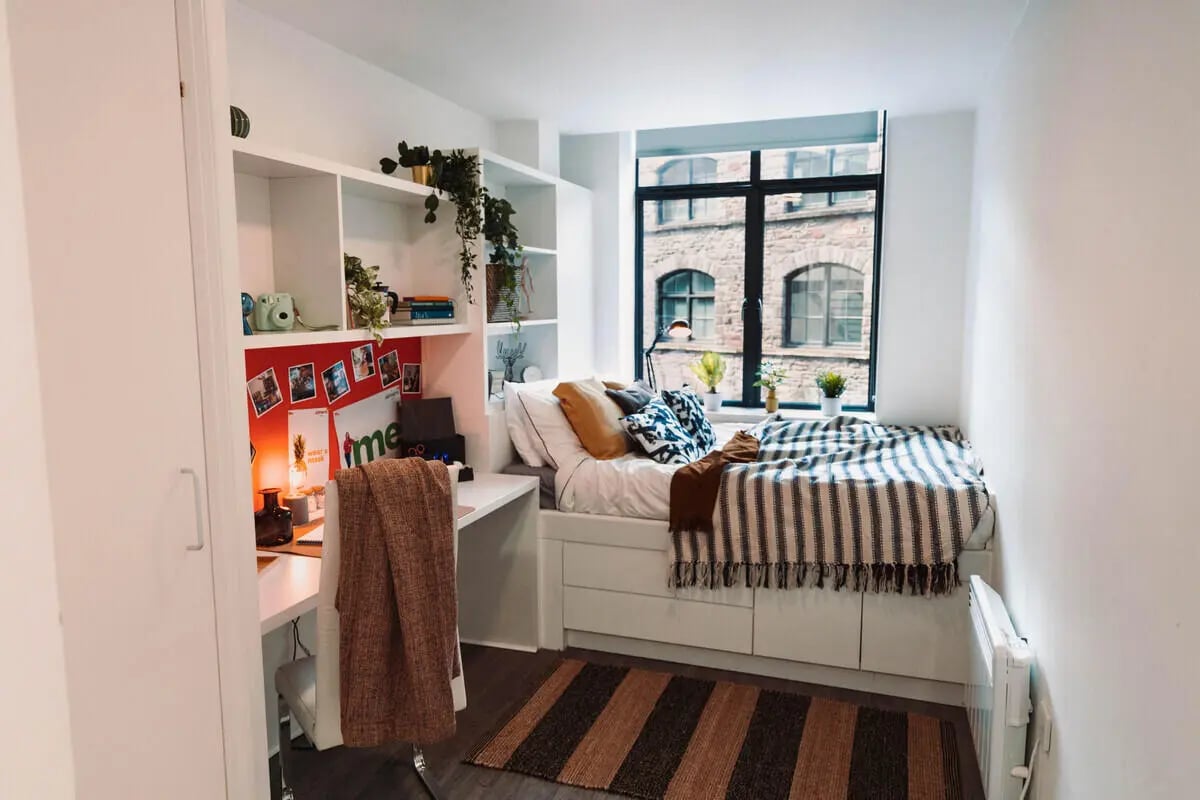 Bed desk shelving plants and window bedroom at Stonebridge House in Bristol Student Accommodation