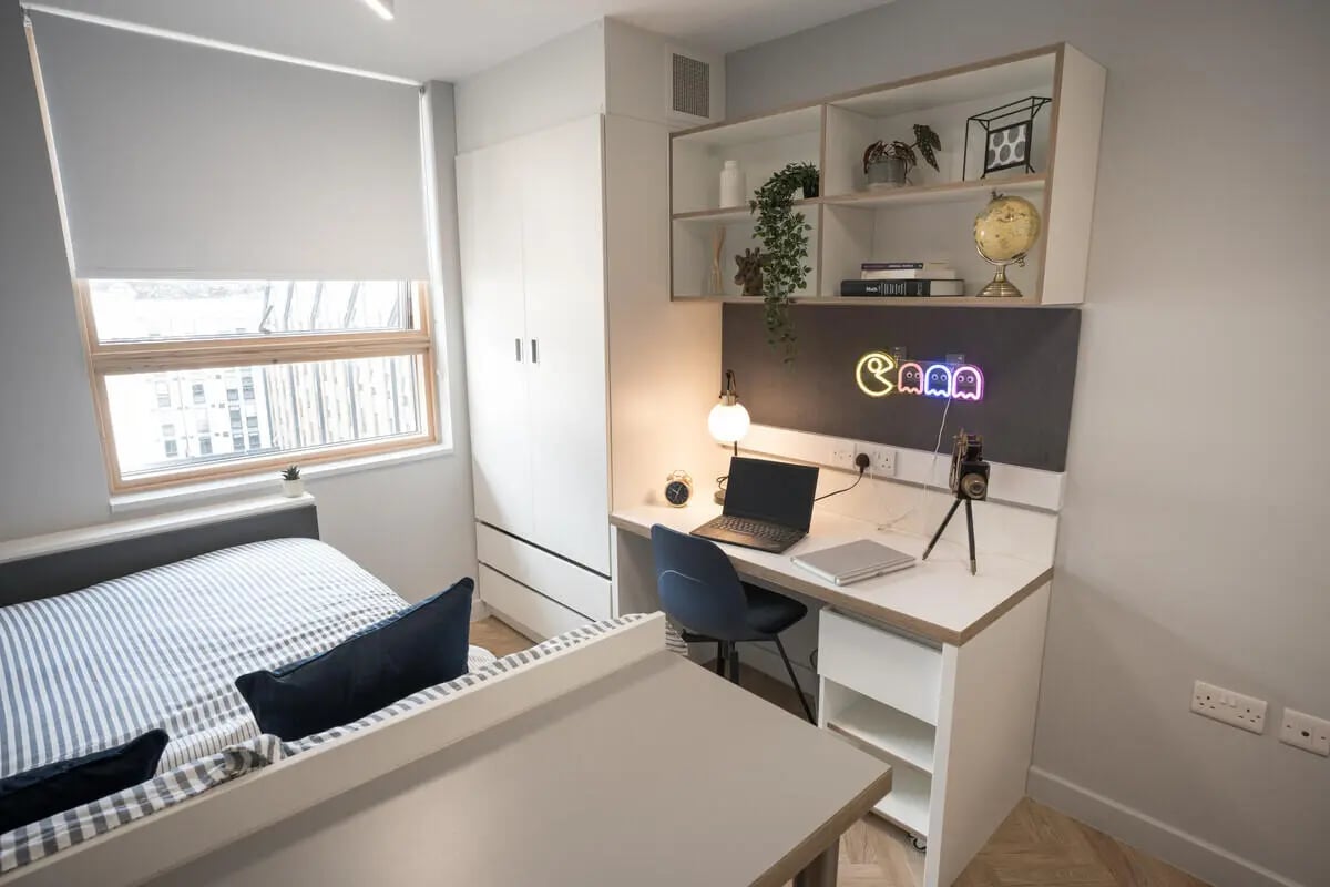 Bed desk wardrobe with neon lights bedroom at The Depot in Bath Student Accommodation