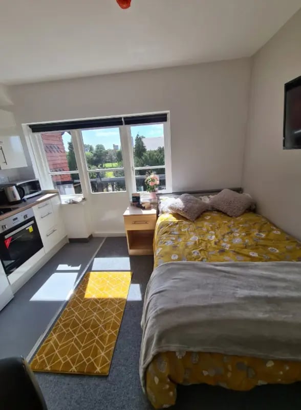 Bed kitchen and window view bedroom at Salisbury Road in Leicester Student Accommodation