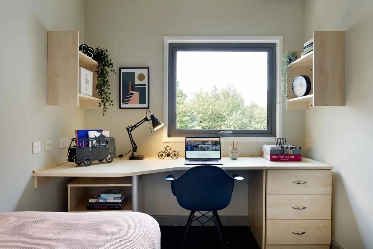 Desk with laptop chair and shelves study area at Alexandra Works in Plymouth Student Accommodation