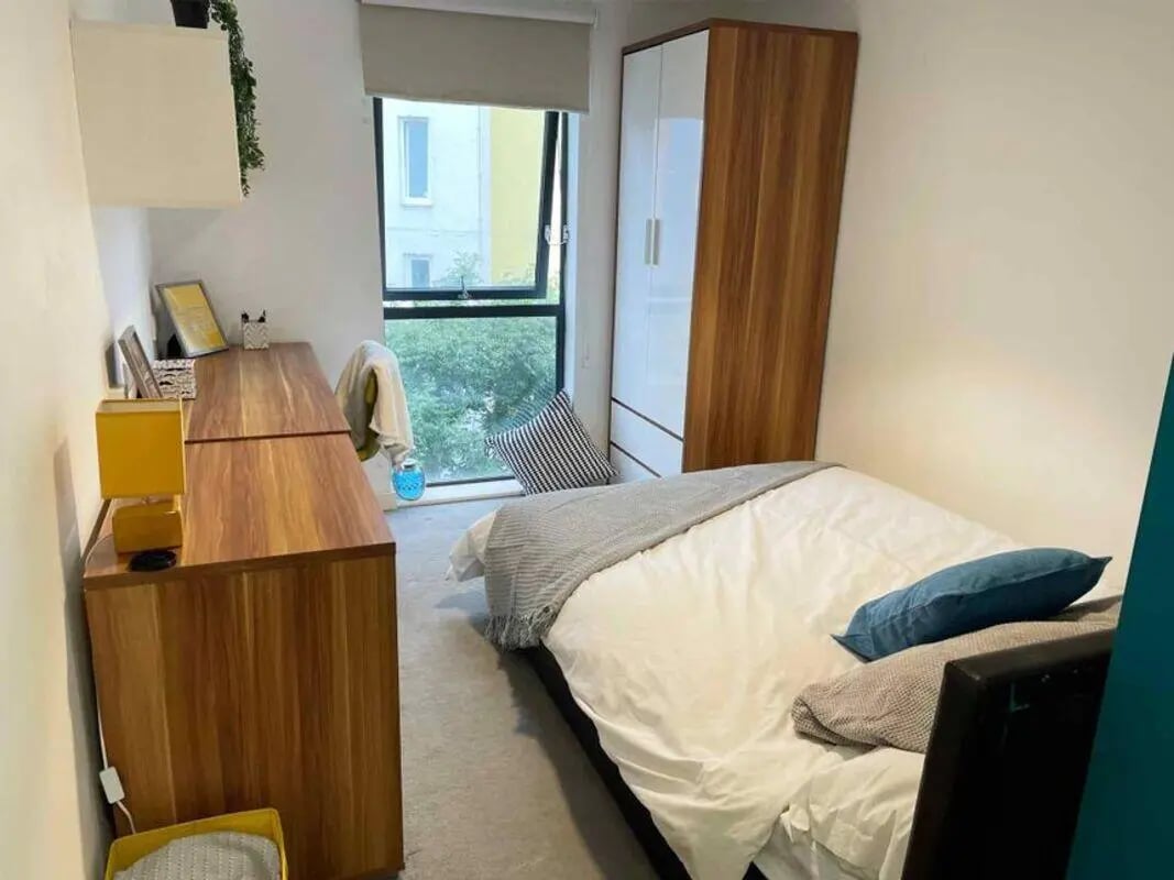 Bed desk wardrobe window view bedroom at Austin Hall in Leeds Student Accommodation