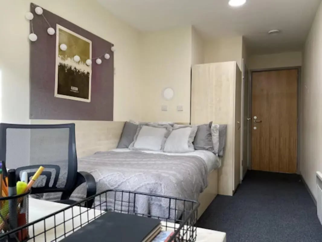 Bed chair wardrobe door bedroom at Buchanan View in Glasgow Student Accommodation