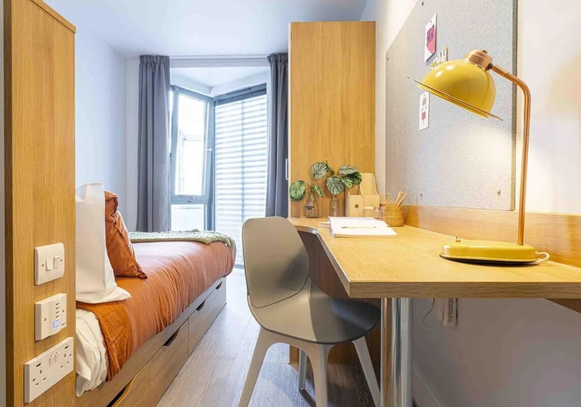 Bed desk with lamp and chair bedroom at iQ Abacus House in Brighton Student Accommodation