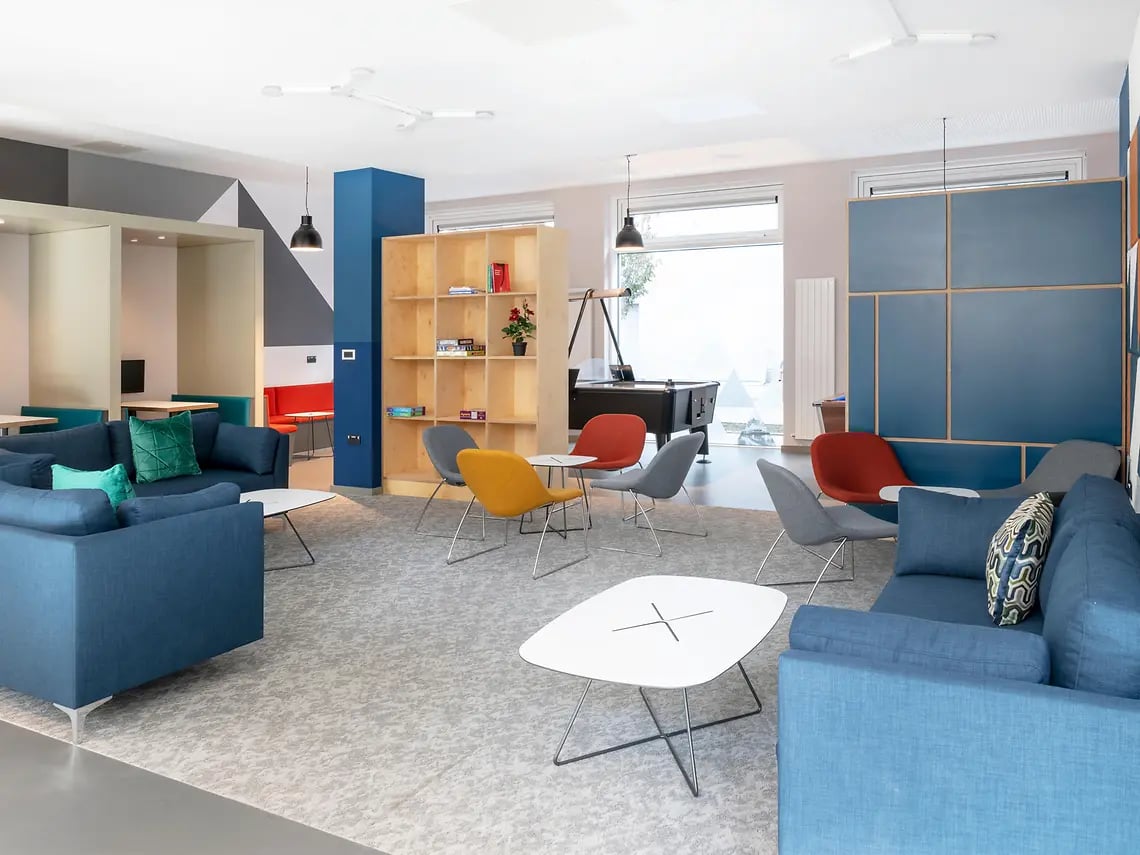 Blue sofas pool table and seating area living room at The Tannery in Dublin Student Accommodation