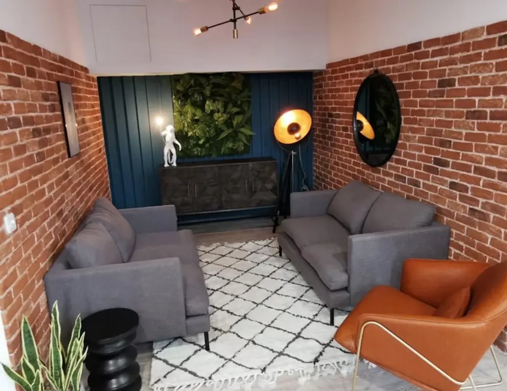 Two grey sofas a tan chair and rug living room at Little Patrick Street in Belfast Student Accommodation