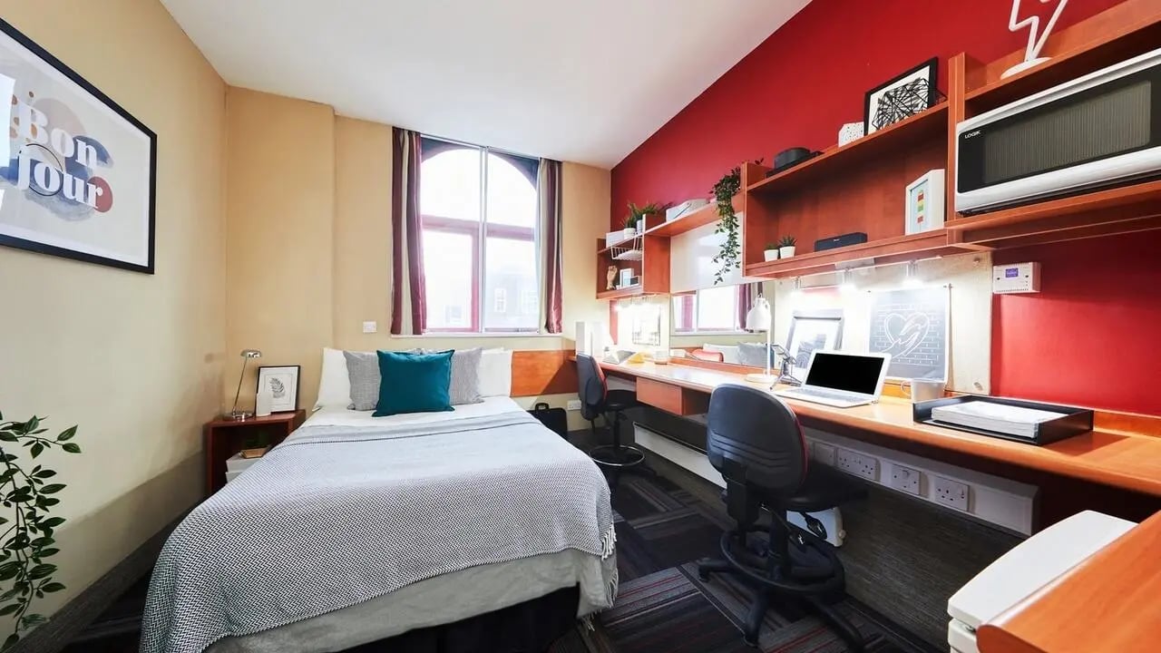 Bed desk microwave and shelves study area at Burges House in Coventry Student Accommodation