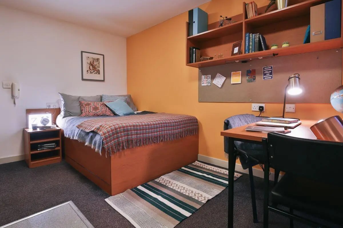 Bed desk and shelves student accommodation bedroom at 99 Penny Street in Lancaster Student Accommodation