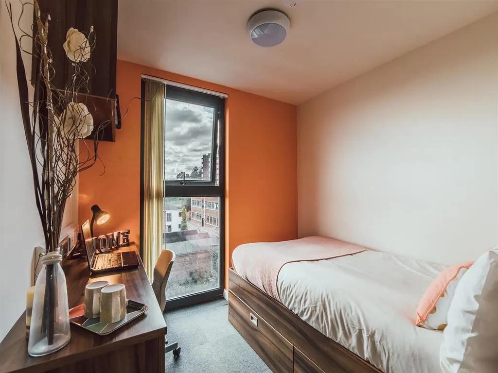 Bed desk window and chair bedroom at Lomax Halls in Stoke-On-Trent Student Accommodation