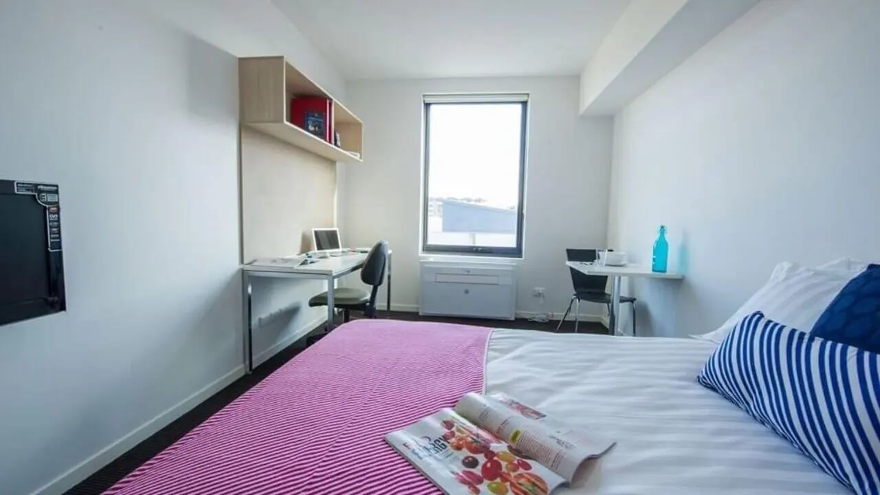 Bed desk and TV bedroom at Student Living on Cobden in Melbourne Student Accommodation