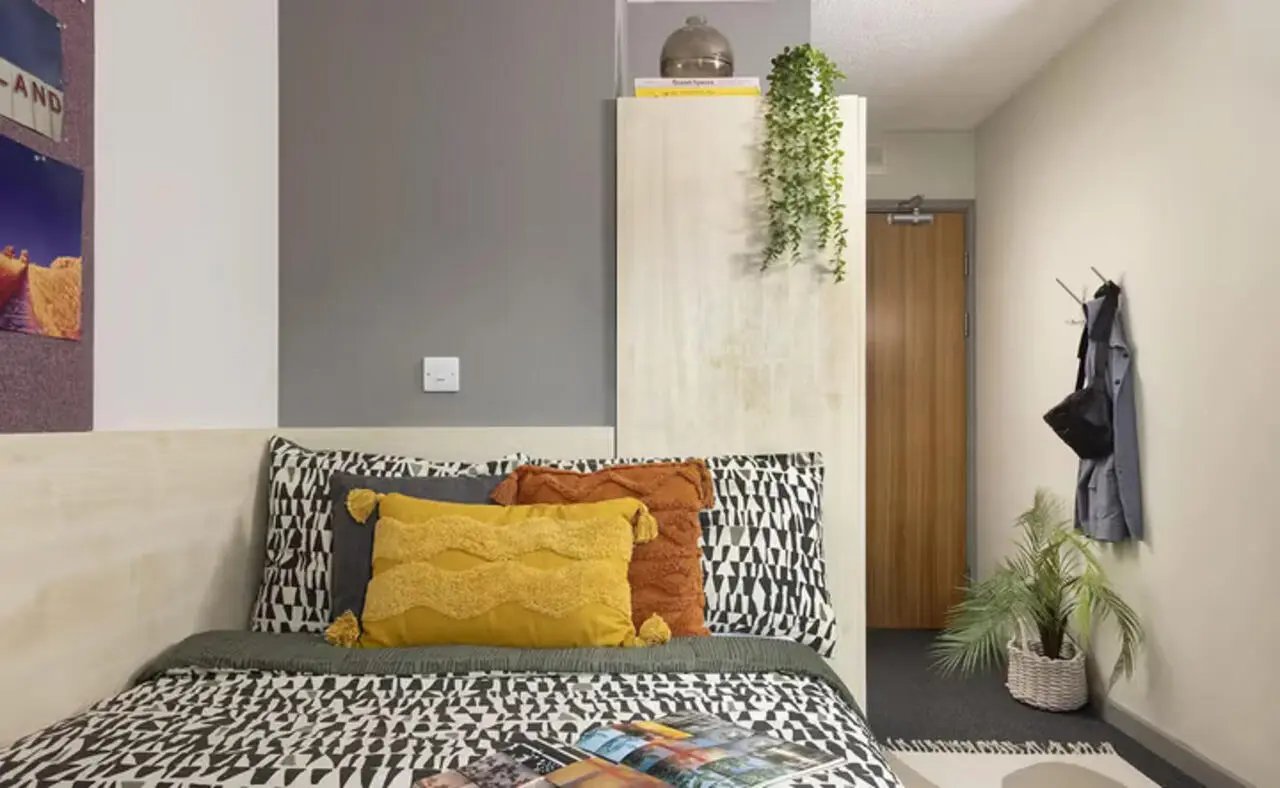 Bed with patterned duvet and pillows bedroom at Concept Place in Leeds Student Accommodation