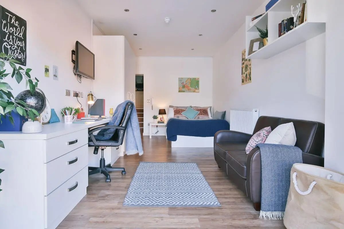 Desk bed sofa rug and chair studio room at 134 New Walk Leicester in Leicester Student Accommodation