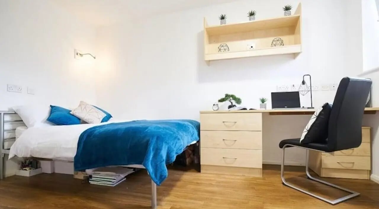 Bed desk chair and storage bedroom at Manchester House in Manchester Student Accommodation