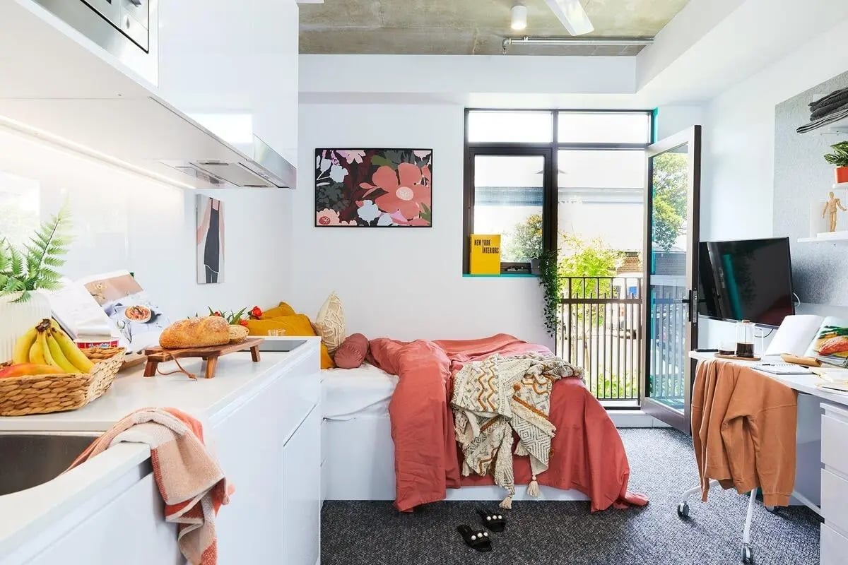 Bed desk kitchen sink fruit basket studio apartment at Scape Darlington in Sydney Student Accommodation