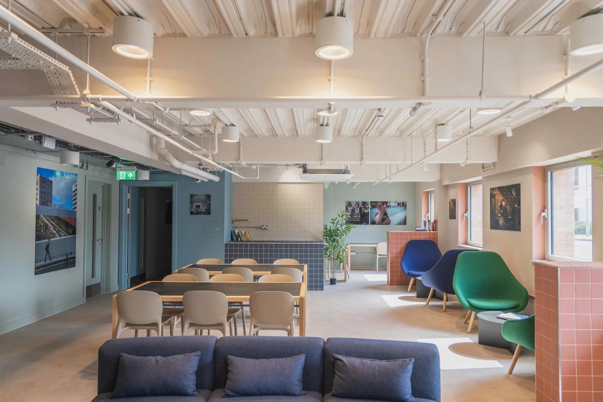 Sofa tables chairs and colorful seating communal area at Pershore Junction in Birmingham Student Accommodation