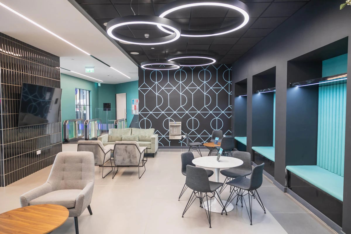 Sofas chairs table TV and booths common area at Onyx Birmingham in Birmingham Student Accommodation
