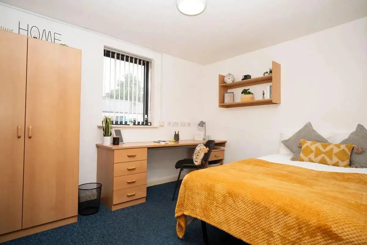 Wardrobe desk bed shelf bedroom at Moor Lane Halls in Preston Student Accommodation