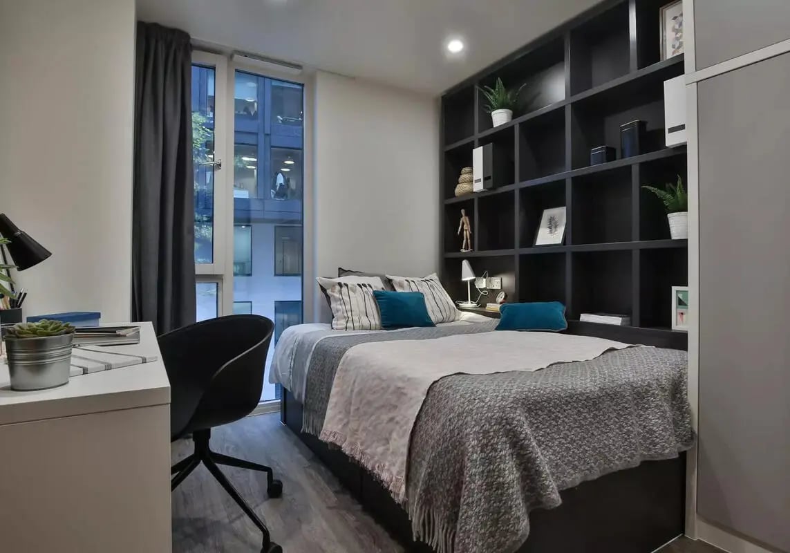 Bed desk bookshelf window view Bedroom at iQ Shoreditch in London Student Accommodation