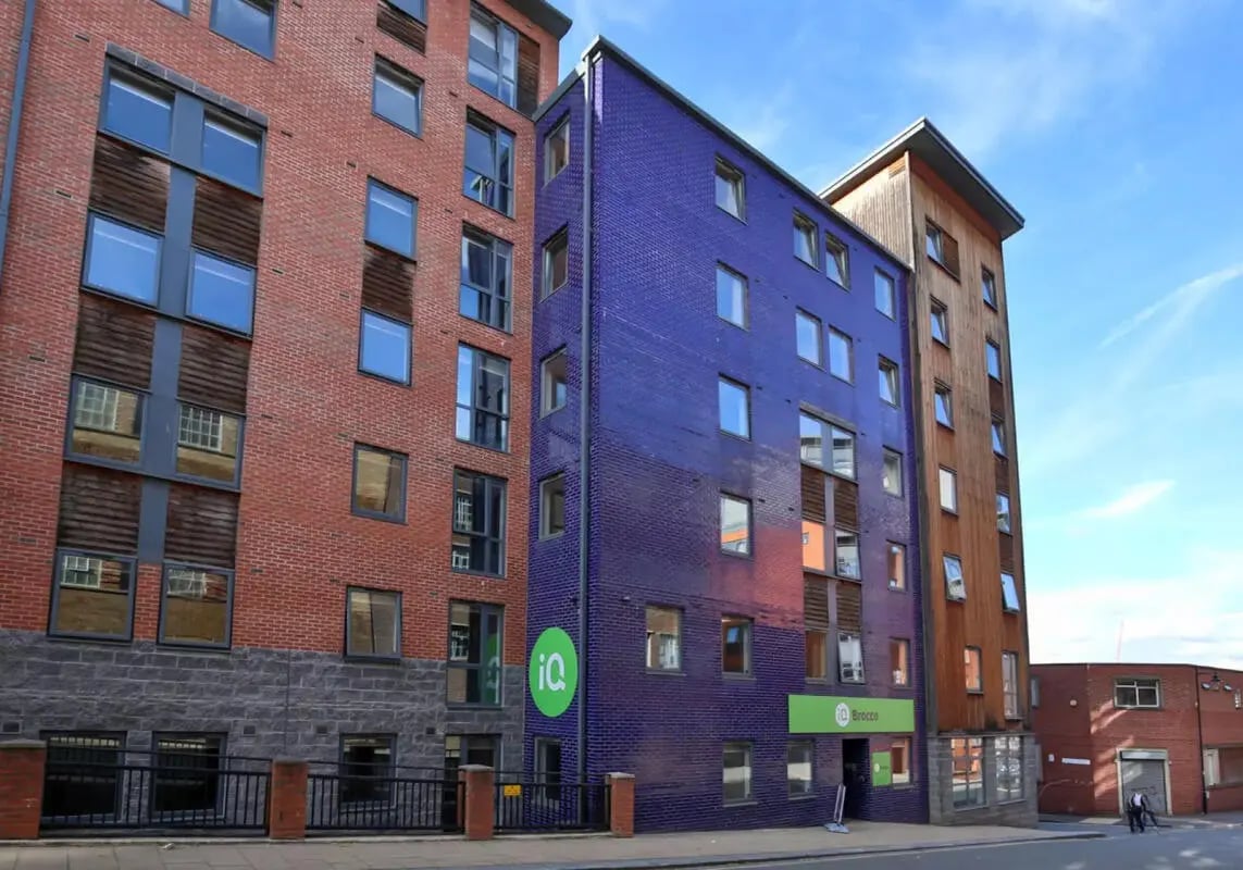 Apartment building with red blue wood exterior exterior at iQ Brocco in Sheffield Student Accommodation