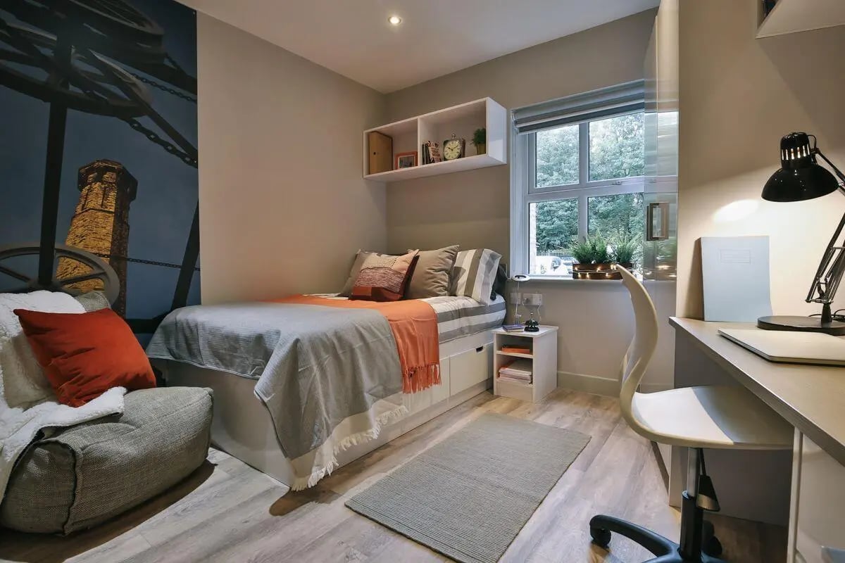 Bed chair desk lamp and window bedroom at Kingsmill Studios in Huddersfield Student Accommodation