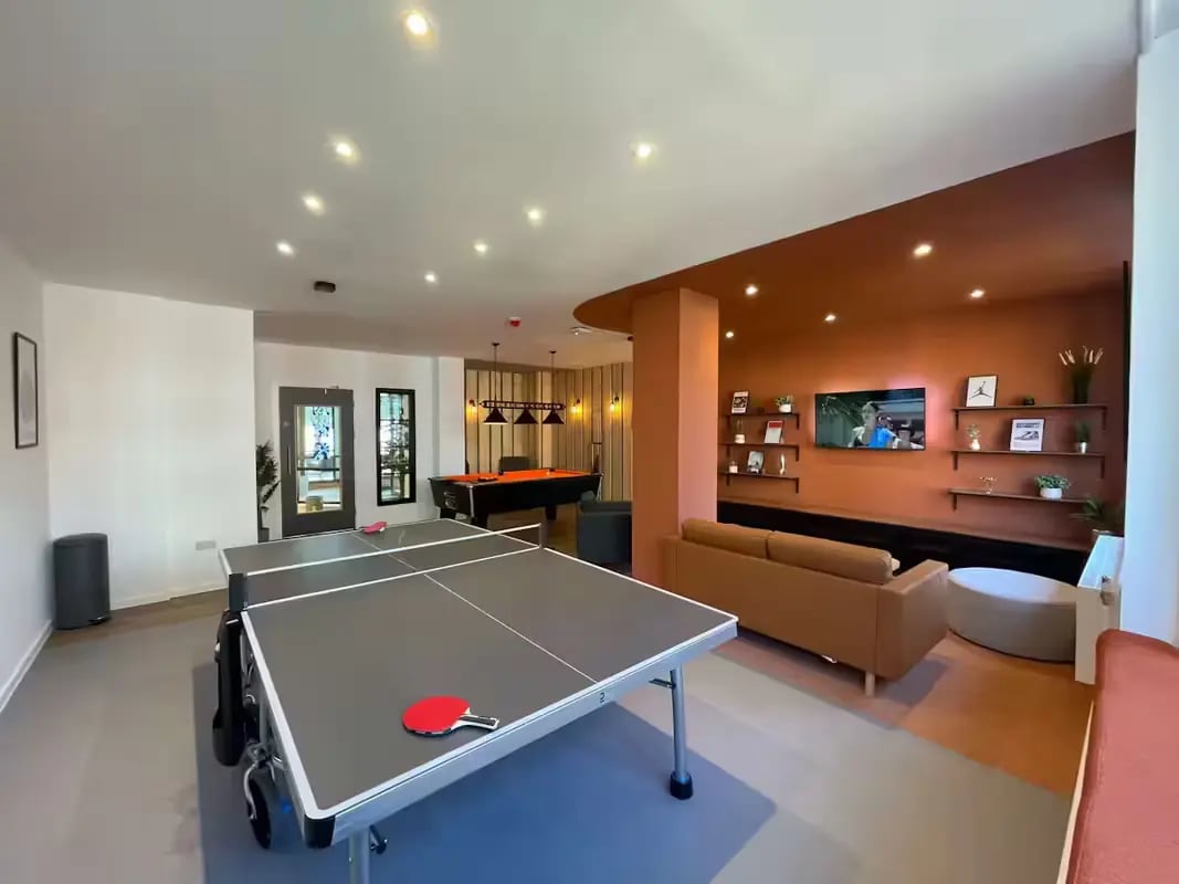 Ping pong table pool table sofa living room at The Bridge Guildford in Guildford Student Accommodation