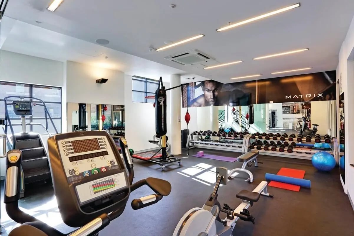 Gym equipment with weights punching bag and yoga mats gym at Scape Cleveland in Sydney Student Accommodation