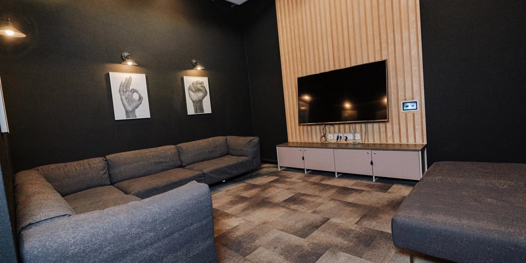 Large sectional sofa modern cabinet television living room at Canvas Coventry City Point in Coventry Student Accommodation