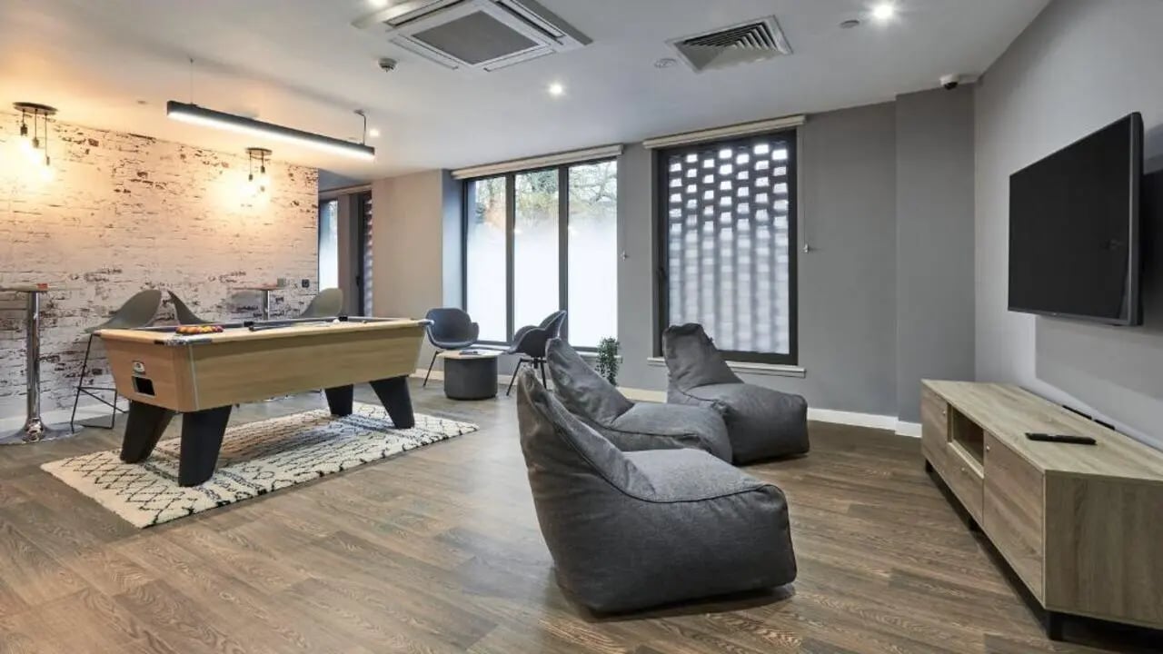 Pool table beanbags TV and entertainment unit common area at 41 Castle Street in Leicester Student Accommodation