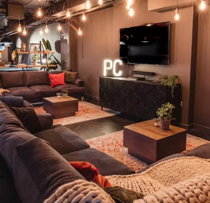 Large sectional sofas coffee tables and TV living room at Portsburgh Court in Edinburgh Student Accommodation
