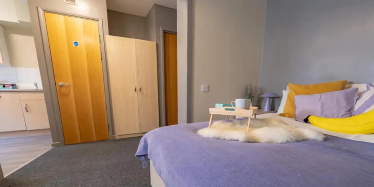Bed with tray pillows and banana pillow bedroom at The Heights in Birmingham Student Accommodation