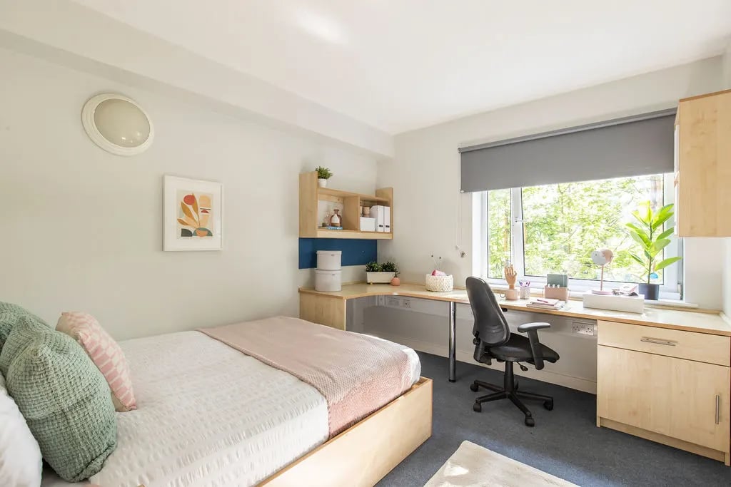 Bed desk chair and window Bedroom study area at Charlotte Court in Sheffield Student Accommodation