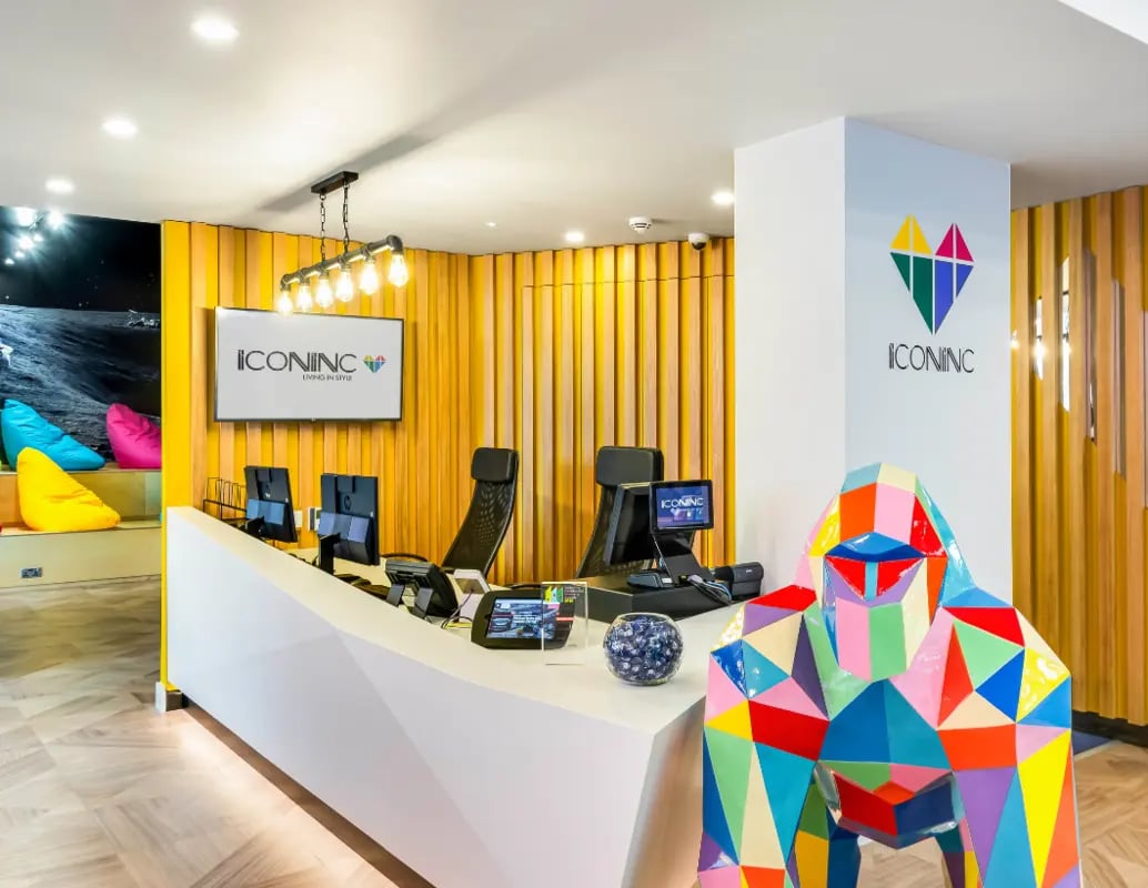 Reception desk computers beanbags colorful gorilla reception area at Iconinc The Triangle in Leeds Student Accommodation