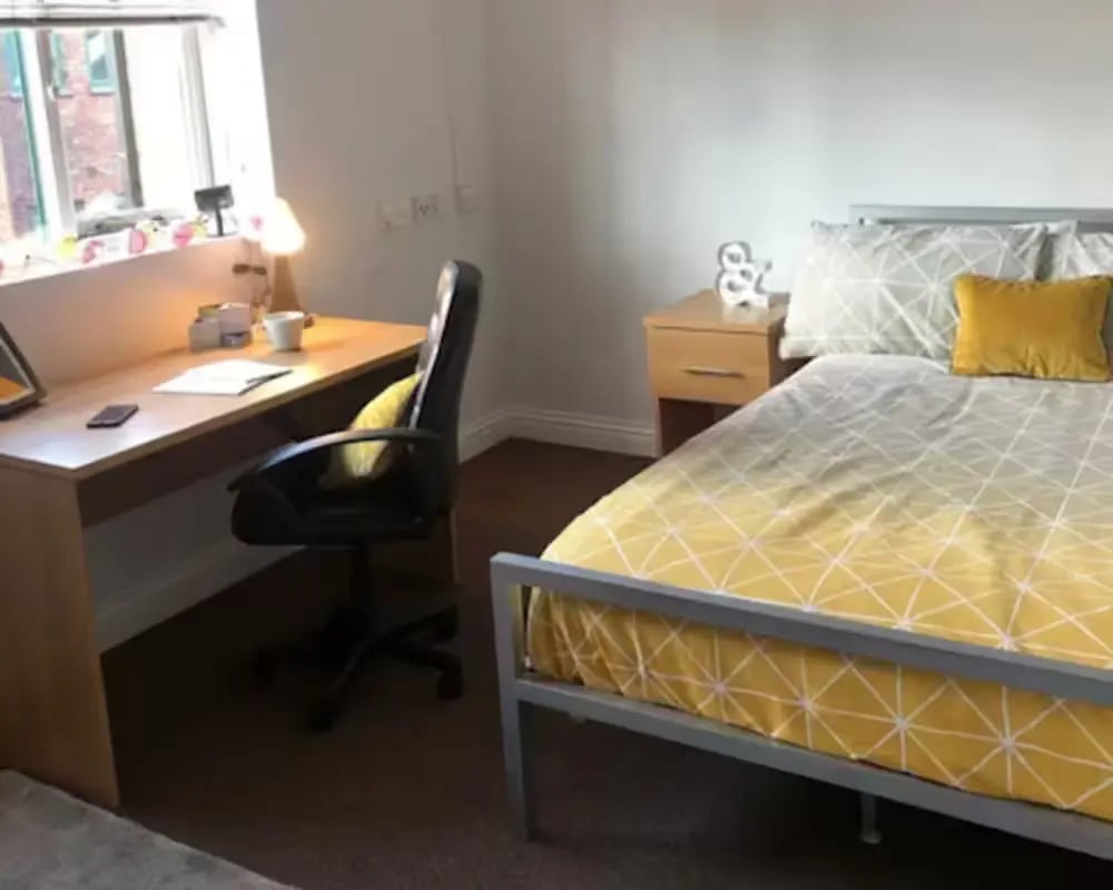 Desk chair bed bedside table bedroom at Solly House - Central Place in Sheffield Student Accommodation