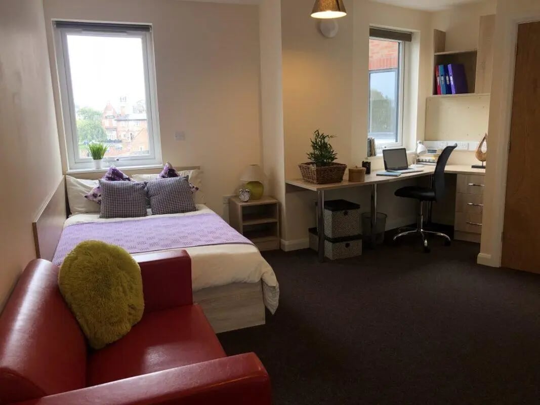 Bed desk sofa and chair student room at Jubilee Court in Preston Student Accommodation