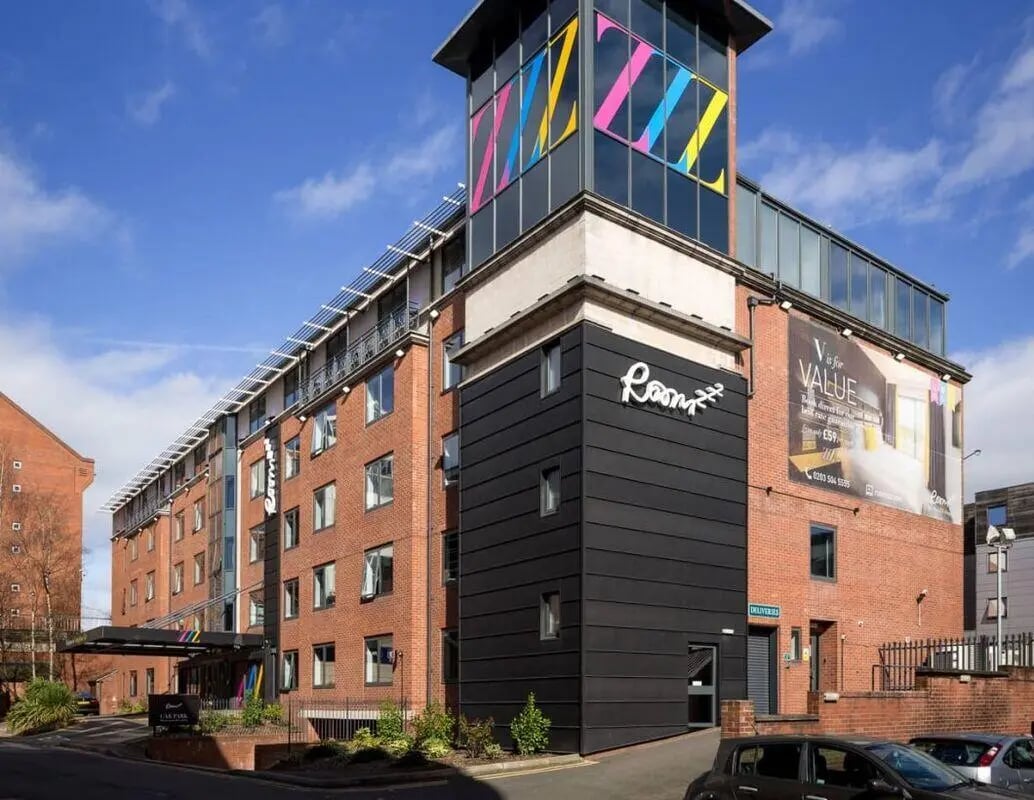 Red brick building with large windows exterior at IconInc Nottingham City in Nottingham Student Accommodation