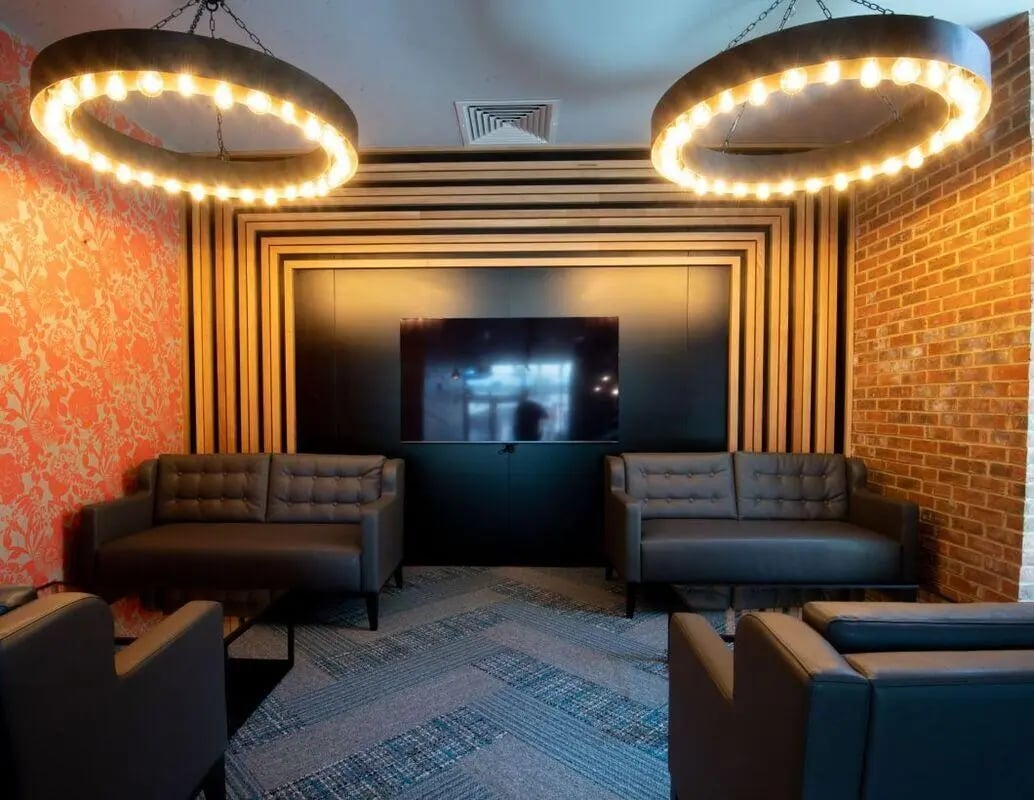 Two grey sofas, TV, and lamps living room at IconInc Newcastle City in Newcastle Upon Tyne Student Accommodation