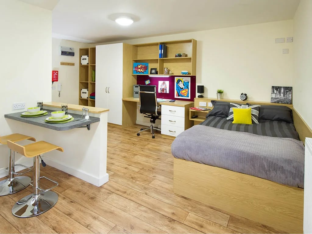 Bed desk shelving and breakfast bar bedroom at Quebec House in Kingston Upon Thames Student Accommodation