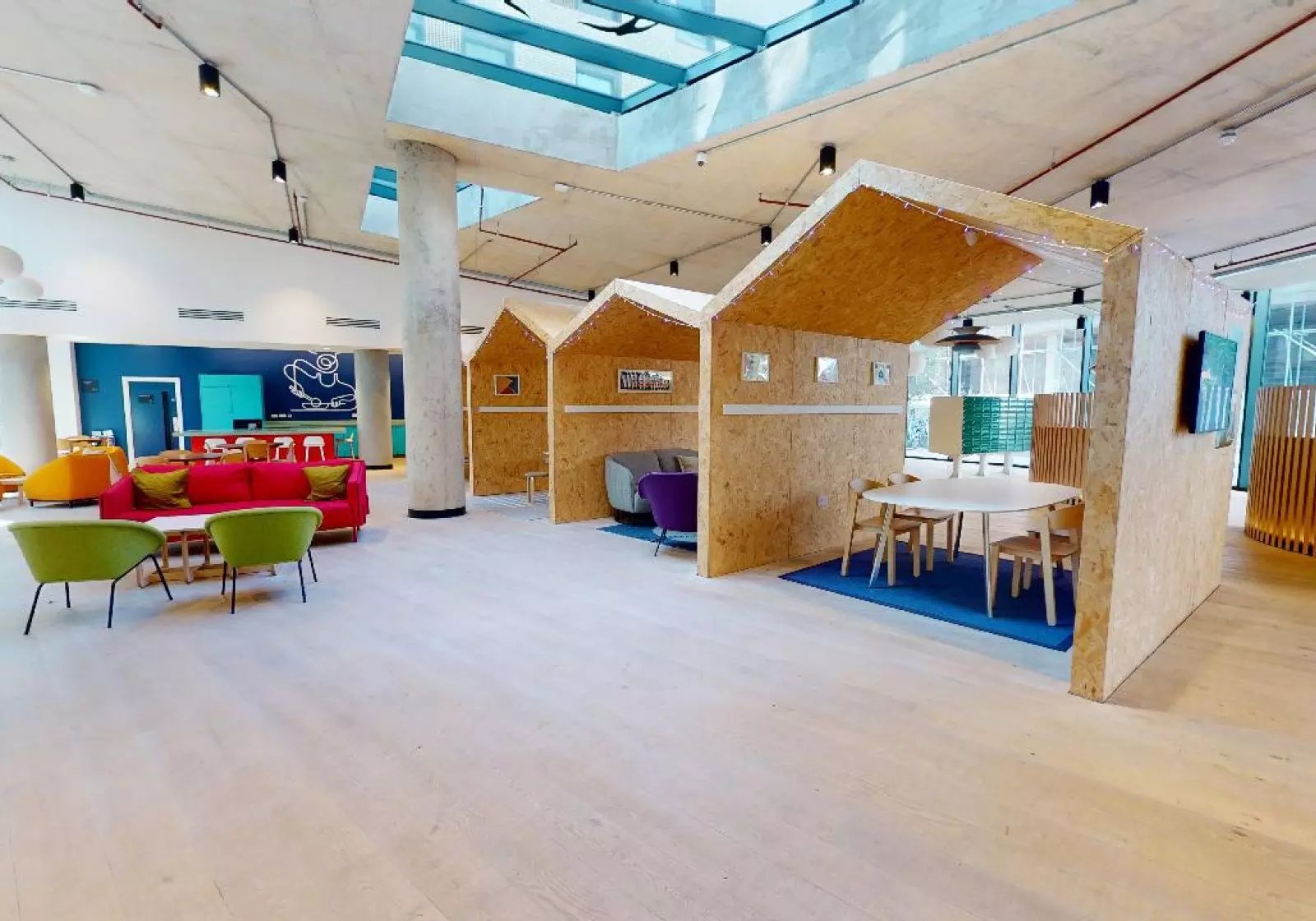 Modern seating booths and dining area common room at iQ Brighton in Brighton Student Accommodation