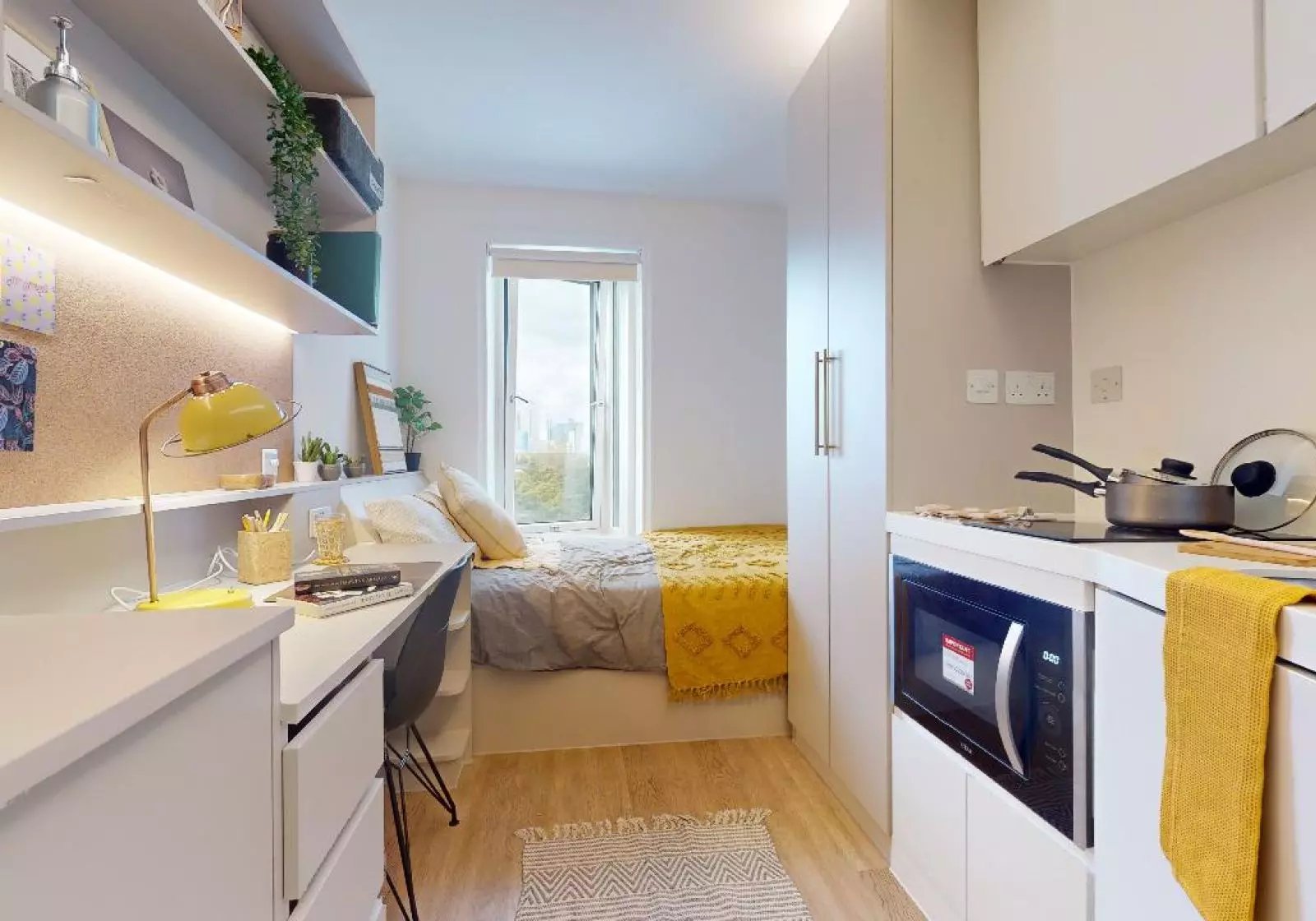 Desk bed microwave kitchen studio at iQ East Court in London Student Accommodation
