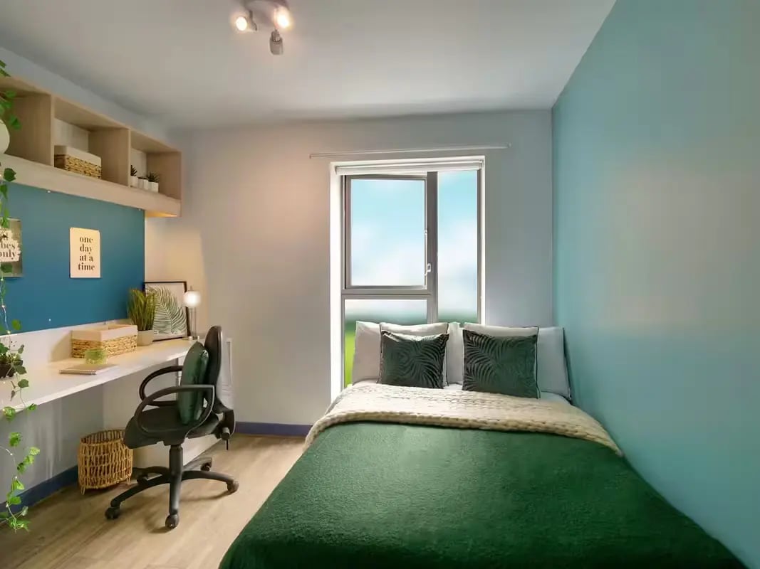 Desk chair bed window and shelves bedroom at Bright House in Kingston Upon Thames Student Accommodation
