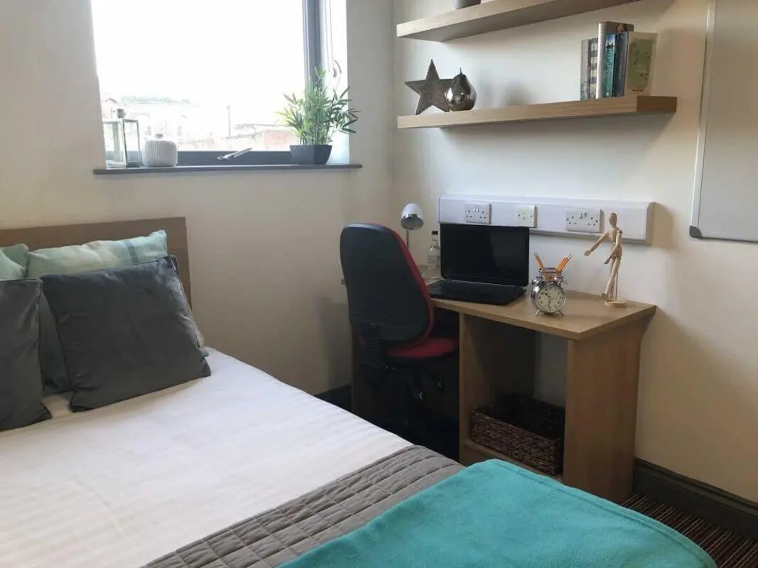 Bed desk laptop and chair bedroom at Norflok Street in Sunderland Student Accommodation