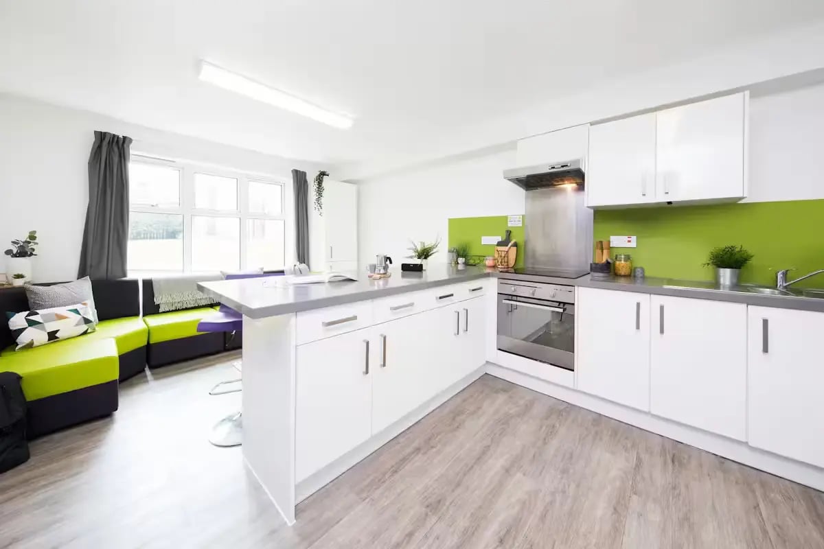 Modern kitchen with island and sofa living area kitchen at Paddington Park House in Liverpool Student Accommodation
