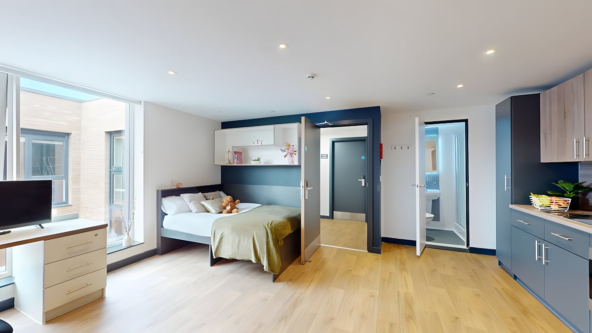 Bed, desk, kitchen and bathroom student studio at Innovo House in Liverpool Student Accommodation