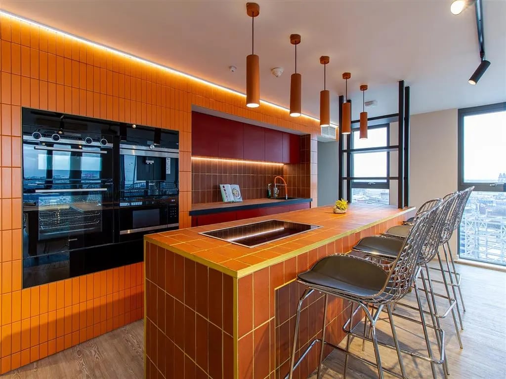 Modern kitchen with ovens island bar stools kitchen at Calico in Liverpool Student Accommodation