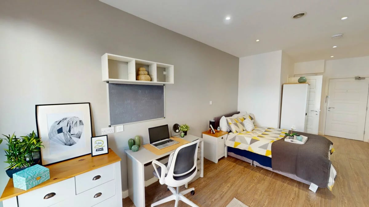 Bed desk with laptop artwork bedroom and study area at St Marks Court - Nottingham in Nottingham Student Accommodation